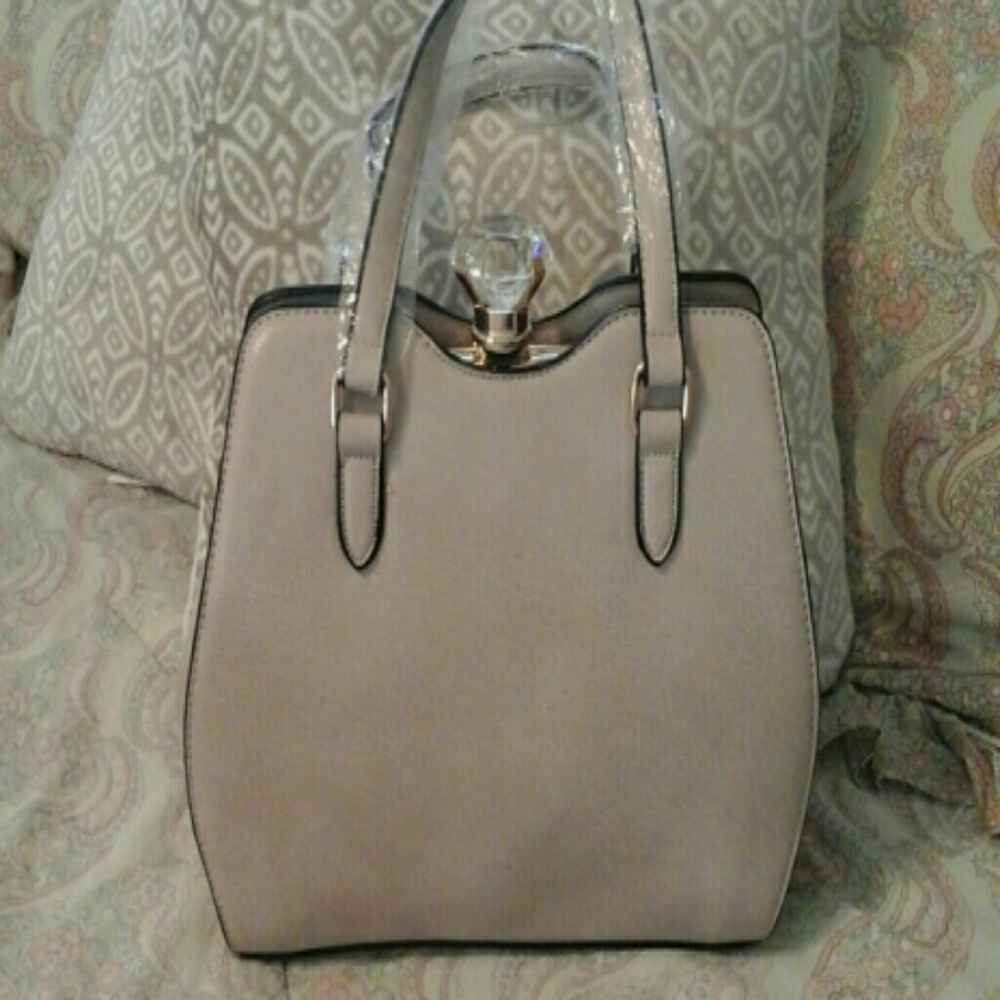 beautiful purse with a diamond lock on top